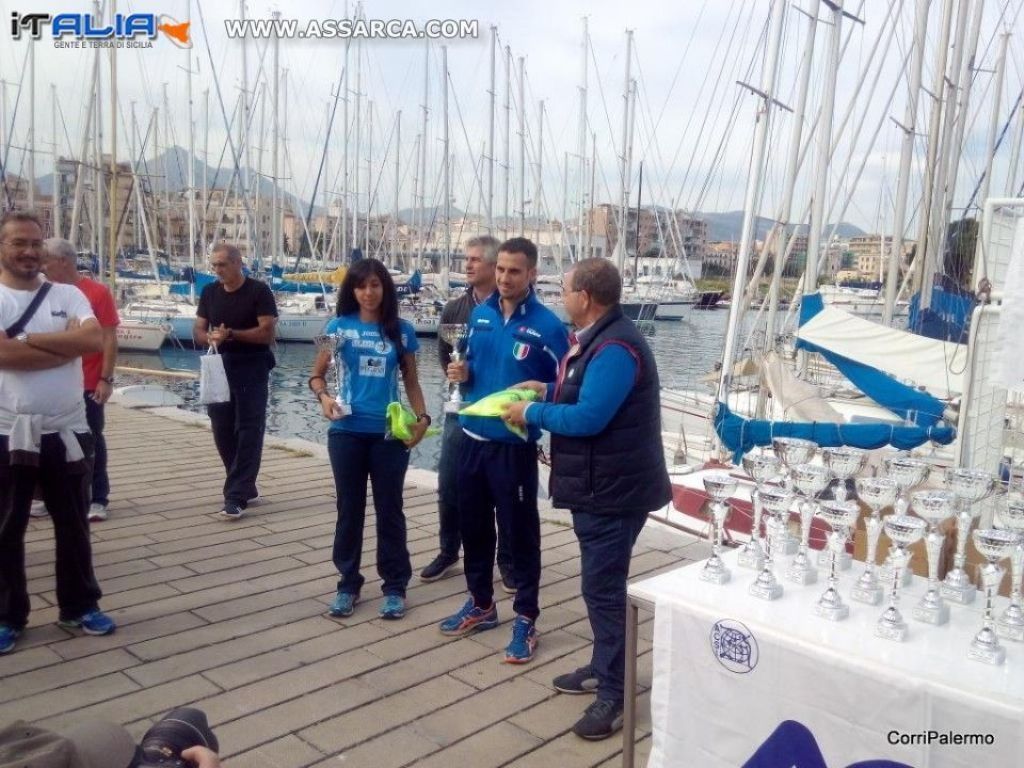 PODISMO: VITTORIE DI PREGIO ALLA CURRI A CALA PER IL PINK DAY,  VINCENZO AGNELLO E CHIARA IMMESI   SUL GRADINO PI ALTO DEL PODIO.